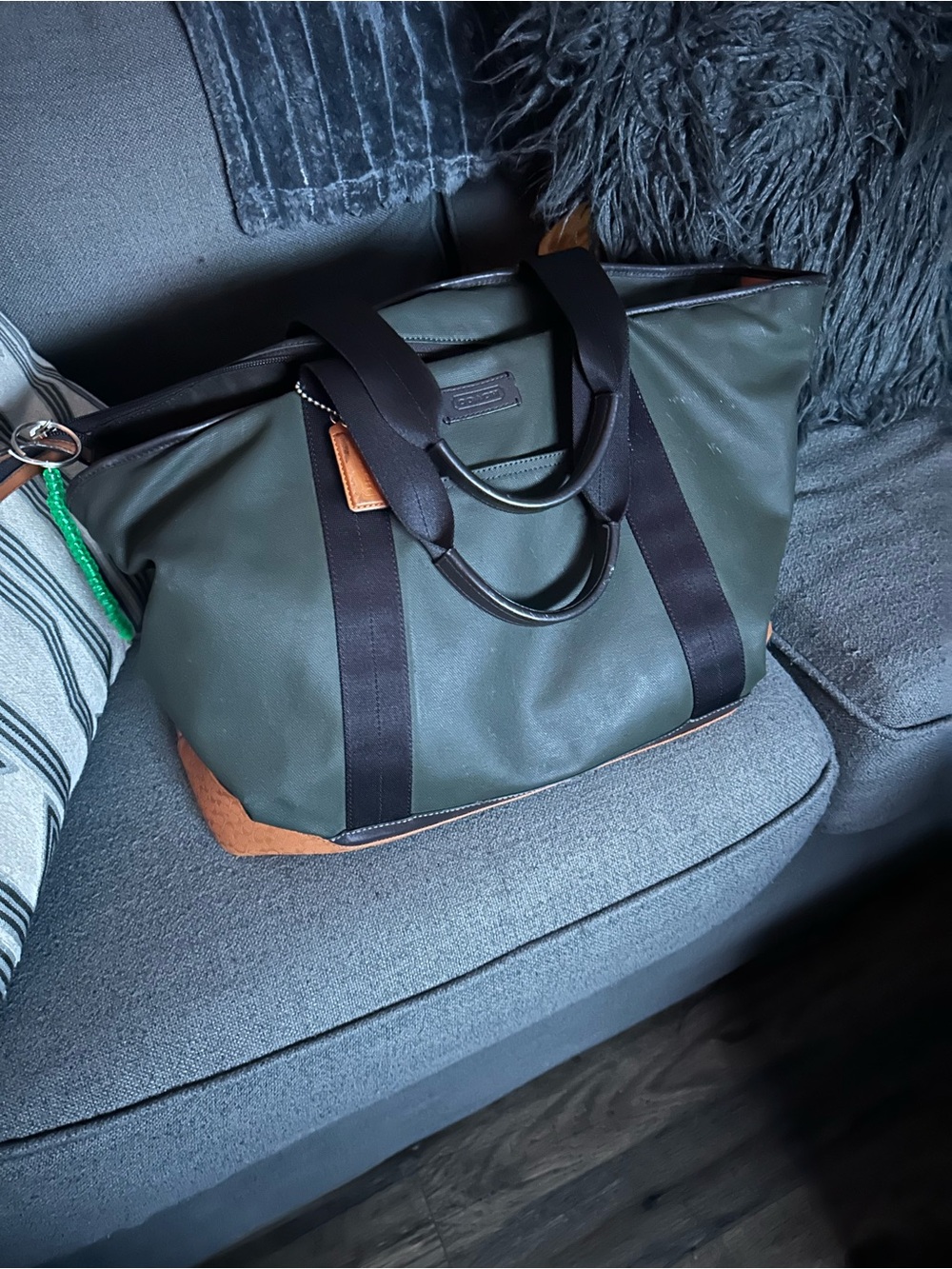 Coach Olive Green Duffel Bag with Black Straps and Tan Accents
